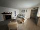 Spacious living room with fireplace and tile flooring at 5587 Devonbriar Way # 105, Orlando, FL 32822