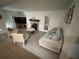Spacious living room with fireplace and tile flooring at 5587 Devonbriar Way # 105, Orlando, FL 32822