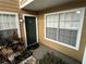 Front door entrance with landscaping at 5587 Devonbriar Way # 105, Orlando, FL 32822