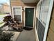 Front door entrance with landscaping at 5587 Devonbriar Way # 105, Orlando, FL 32822