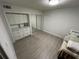 Bright bedroom with mirrored closet and built-in shelving at 5587 Devonbriar Way # 105, Orlando, FL 32822