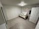 Cozy bedroom with double bed and wood dresser at 5587 Devonbriar Way # 105, Orlando, FL 32822