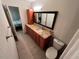 Well-appointed bathroom with granite countertops and a toilet at 5587 Devonbriar Way # 105, Orlando, FL 32822
