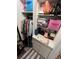 Organized walk-in closet with shelves and hanging rods at 5587 Devonbriar Way # 105, Orlando, FL 32822