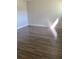 Well-lit bedroom featuring wood-look floors at 914 Lake Destiny Rd # H, Altamonte Springs, FL 32714