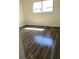 Sunlit bedroom with wood-look floors and a window at 914 Lake Destiny Rd # H, Altamonte Springs, FL 32714