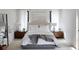 Bright bedroom with neutral tones, plush bedding, and wood nightstands at 33 S Graham Ave, Orlando, FL 32803