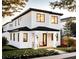 Stunning two-story modern home with white exterior and black accents at 33 S Graham Ave, Orlando, FL 32803