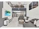 Open concept living area with sectional sofa and view into kitchen at 2723 Plume Rd, Clermont, FL 34711