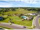 Aerial view of community pool, playground, and surrounding green space at 2723 Plume Rd, Clermont, FL 34711