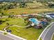 Aerial view showing community pool, playground, and green areas at 2723 Plume Rd, Clermont, FL 34711