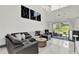 Spacious living room featuring a sectional sofa and access to a patio at 2723 Plume Rd, Clermont, FL 34711