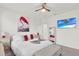 Serene bedroom with king-size bed and large TV at 2723 Plume Rd, Clermont, FL 34711