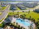 Aerial view of community pool and surrounding homes at 2723 Plume Rd, Clermont, FL 34711