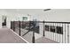 Upstairs hall with a loft area and a view of the lower level at 2723 Plume Rd, Clermont, FL 34711