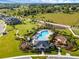 Aerial view of community amenities including pool, playground, and green space at 2723 Plume Rd, Clermont, FL 34711