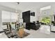 Open concept dining area with glass table and modern pendant lighting at 2723 Plume Rd, Clermont, FL 34711