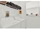 Laundry room with washer, dryer, and shelving at 2723 Plume Rd, Clermont, FL 34711