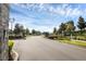Gated entrance to a residential community featuring stone pillars and lush landscaping at 2723 Plume Rd, Clermont, FL 34711