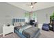 Stylish bedroom with a full-size bed and workspace at 2723 Plume Rd, Clermont, FL 34711