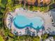 Relaxing kidney-shaped pool with plenty of lounge chairs at 2723 Plume Rd, Clermont, FL 34711