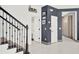 Modern staircase with black metal railing and gray carpeting at 2723 Plume Rd, Clermont, FL 34711