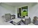 Covered patio with grill and comfortable seating at 2723 Plume Rd, Clermont, FL 34711
