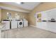 Well-lit laundry facility with multiple washers and dryers at 1069 S Hiawassee Rd # 1336, Orlando, FL 32835