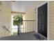 Apartment building entrance with black door and welcome mat at 1069 S Hiawassee Rd # 1336, Orlando, FL 32835