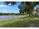 Peaceful lakeside view with lush green grass at 1069 S Hiawassee Rd # 1336, Orlando, FL 32835