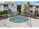 Community hot tub nestled near building entrance at 1069 S Hiawassee Rd # 1336, Orlando, FL 32835