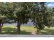 Tranquil lake view from under a tree canopy at 1069 S Hiawassee Rd # 1336, Orlando, FL 32835