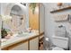 Clean bathroom with a vanity, toilet, and a large mirror at 1069 S Hiawassee Rd # 1336, Orlando, FL 32835