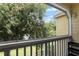 View from screened balcony overlooking trees and lawn at 1069 S Hiawassee Rd # 1336, Orlando, FL 32835