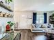 Bright living room with hardwood floors, comfy couch, and stylish decor at 240 People St, Maitland, FL 32751
