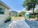 Fenced backyard with a patio, garden area, and a storage shed at 240 People St, Maitland, FL 32751