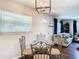 Small dining area with glass-top table and four ornate chairs at 240 People St, Maitland, FL 32751