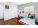 bedroom with red metal bed frame and playful decor at 240 People St, Maitland, FL 32751