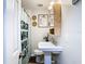 Clean bathroom with updated vanity, a pedestal sink, and a modern shower curtain at 240 People St, Maitland, FL 32751