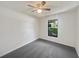 Well-lit bedroom featuring grey carpet and a window at 854 Riverbend Blvd, Longwood, FL 32779