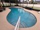 Relaxing kidney-shaped pool with a convenient step entry at 531 Soft Shadow Ln, Debary, FL 32713
