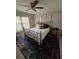 Bedroom with a metal bed frame and blue area rug at 531 Soft Shadow Ln, Debary, FL 32713