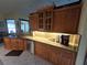 Kitchen with wood cabinets, granite counters, and stainless steel appliances at 531 Soft Shadow Ln, Debary, FL 32713