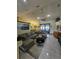 Spacious living room featuring a large sectional sofa and a view to the backyard at 531 Soft Shadow Ln, Debary, FL 32713