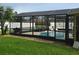 Screened pool enclosure with a spacious grassy backyard at 531 Soft Shadow Ln, Debary, FL 32713