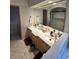 Elegant bathroom with dual sinks, a large mirror, and a walk-in shower at 531 Soft Shadow Ln, Debary, FL 32713