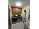 Laundry room with washer, dryer, cabinets, and utility sink at 531 Soft Shadow Ln, Debary, FL 32713