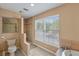 Clean bathroom with walk-in shower and large window at 121 Candlewick Rd, Altamonte Springs, FL 32714