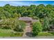 Two-story house with driveway and lush green surroundings at 121 Candlewick Rd, Altamonte Springs, FL 32714