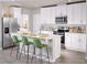 Modern kitchen with stainless steel appliances and an island at 1365 Current Pl, Haines City, FL 33844